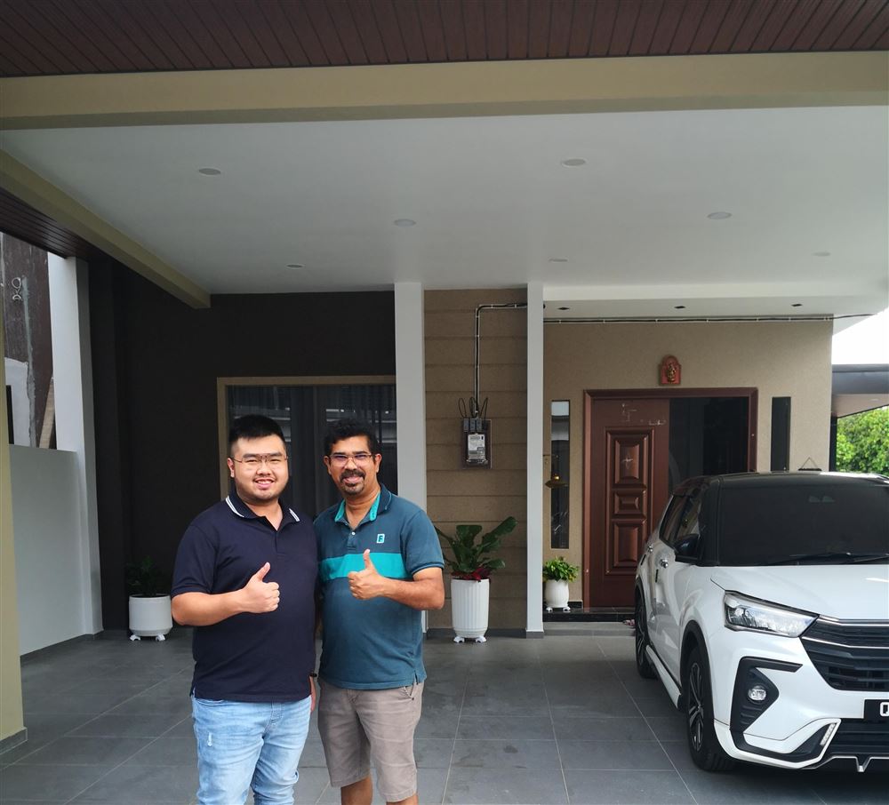 Happy customer with the DOMOS team at handover of a landed home smart system